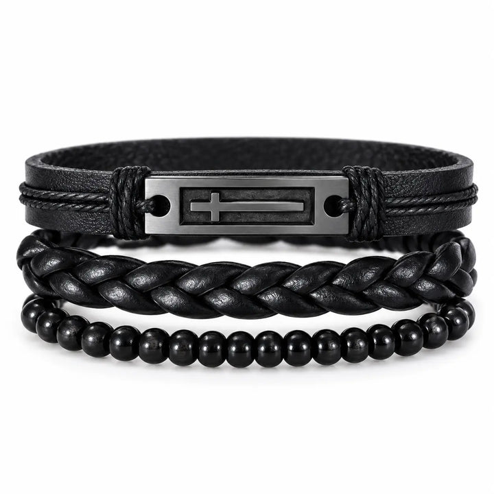 SEYOR men’s three-piece black bracelet set featuring a stainless steel cross plate, braided leather band and polished black beads on white.
