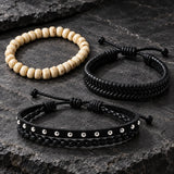 SEYOR men’s three-piece bracelet set featuring ivory stone beads, black woven leather and a silver-studded braided leather band on dark stone.