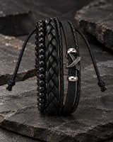 SEYOR men’s black leather and bead bracelet set featuring layered braids and a silver-tone crossed-arrows accent on dark stone.