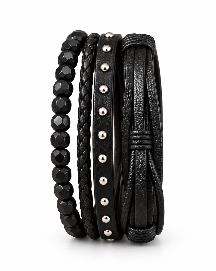 SEYOR men’s black bracelet set featuring faceted beads, braided leather, silver-tone studs and layered leather bands on white.