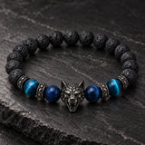Close-up of SEYOR men's black lava stone and blue tiger eye beaded bracelet with a gunmetal wolf charm