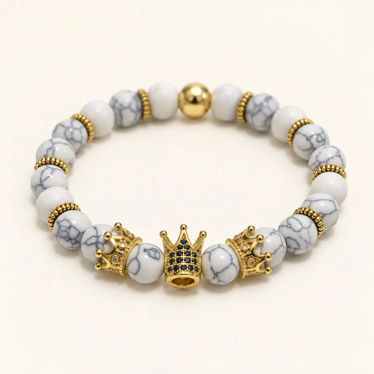 SEYOR men's white howlite bracelet with three detailed gold crowns, blue stones and decorative gold spacers