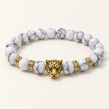 SEYOR men's white howlite bead bracelet with an antique gold leopard head centerpiece and crystal spacers
