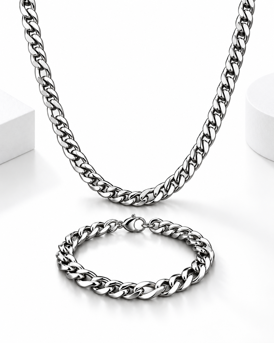 Polished silver Cuban link necklace and matching bracelet displayed on a clean white background.