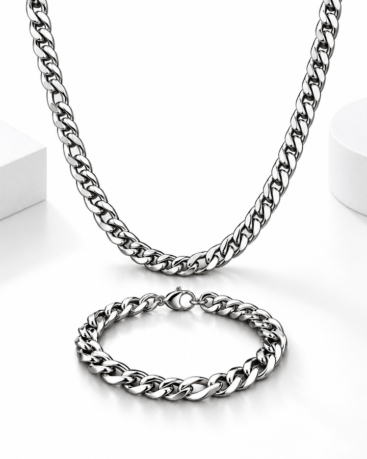 Polished silver Cuban link necklace and matching bracelet displayed on a clean white background.