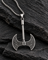 Men’s silver-tone double-headed Viking axe pendant necklace with Celtic knot details displayed on rugged black stone.