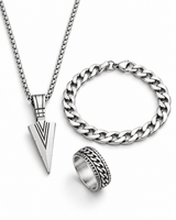 SEYOR men’s silver-tone arrowhead pendant necklace, Cuban chain bracelet and engraved chain-detail ring on a white background.