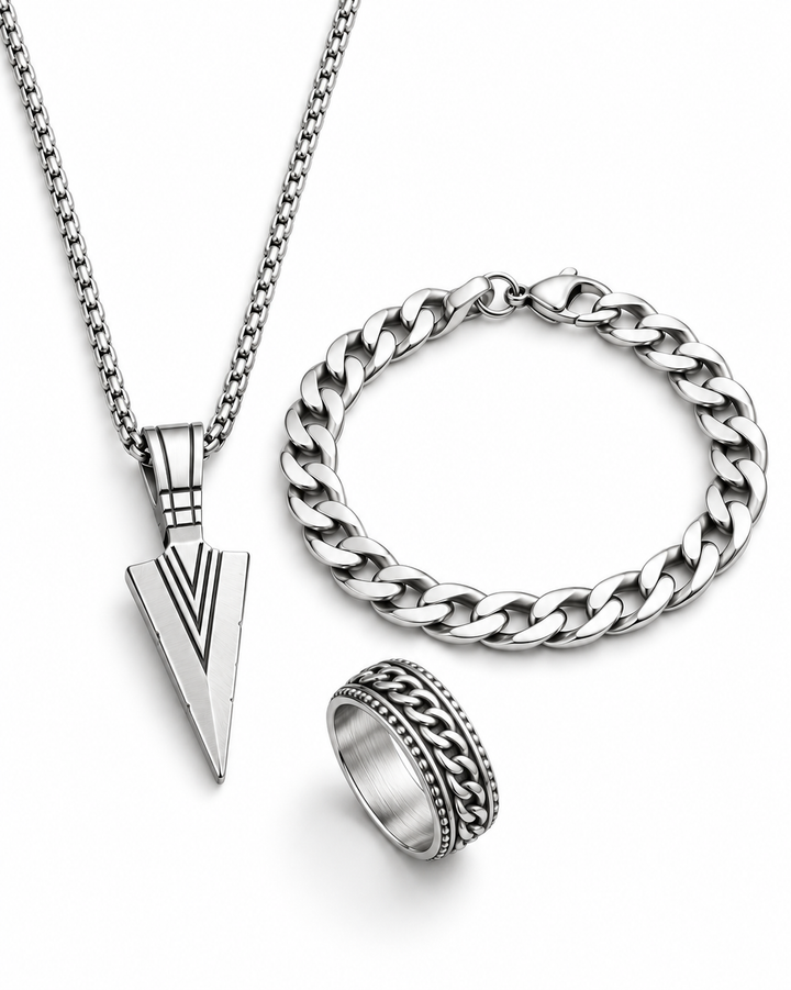 SEYOR men’s silver-tone arrowhead pendant necklace, Cuban chain bracelet and engraved chain-detail ring on a white background.