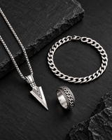 SEYOR men’s silver-tone three-piece set featuring an arrowhead necklace, Cuban chain bracelet and engraved band ring on dark stone.