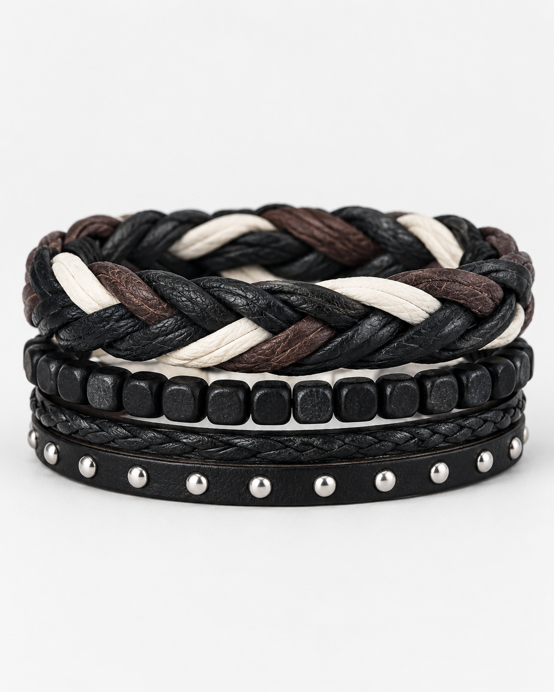 Four-piece men’s bracelet set with multicolor braid, black square beads and silver-tone studs on a white background