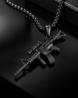 SEYOR black rifle pendant necklace photographed on a glossy black luxury background