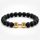 SEYOR men’s porous black lava stone bracelet with a gold-tone dumbbell centerpiece