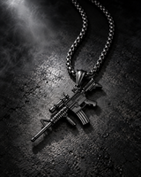 SEYOR men’s black M4 rifle pendant necklace displayed against a dark brushed metal background