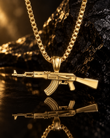 SEYOR gold-tone rifle pendant necklace photographed with warm lighting and a mirrored reflection