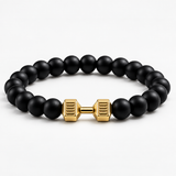 SEYOR men’s smooth matte black beaded bracelet with a polished gold-tone dumbbell centerpiece