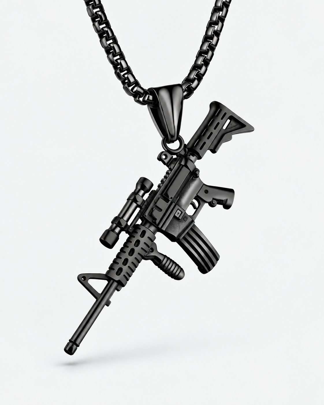 Close-up of SEYOR black tactical rifle pendant with scope and detailed miniature features