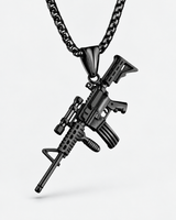Close-up of SEYOR black tactical rifle pendant with scope and detailed miniature features